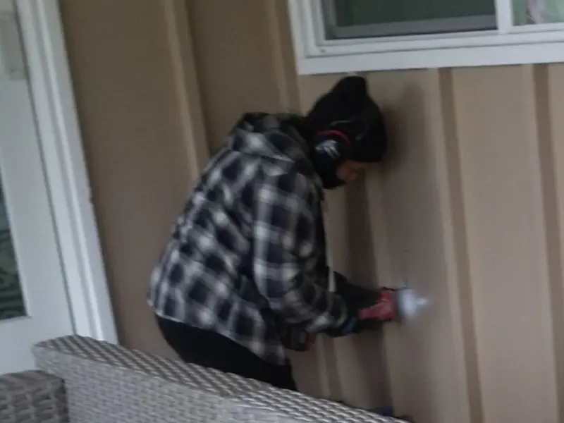 Professional electrician installing an exterior outlet in Dartmouth
