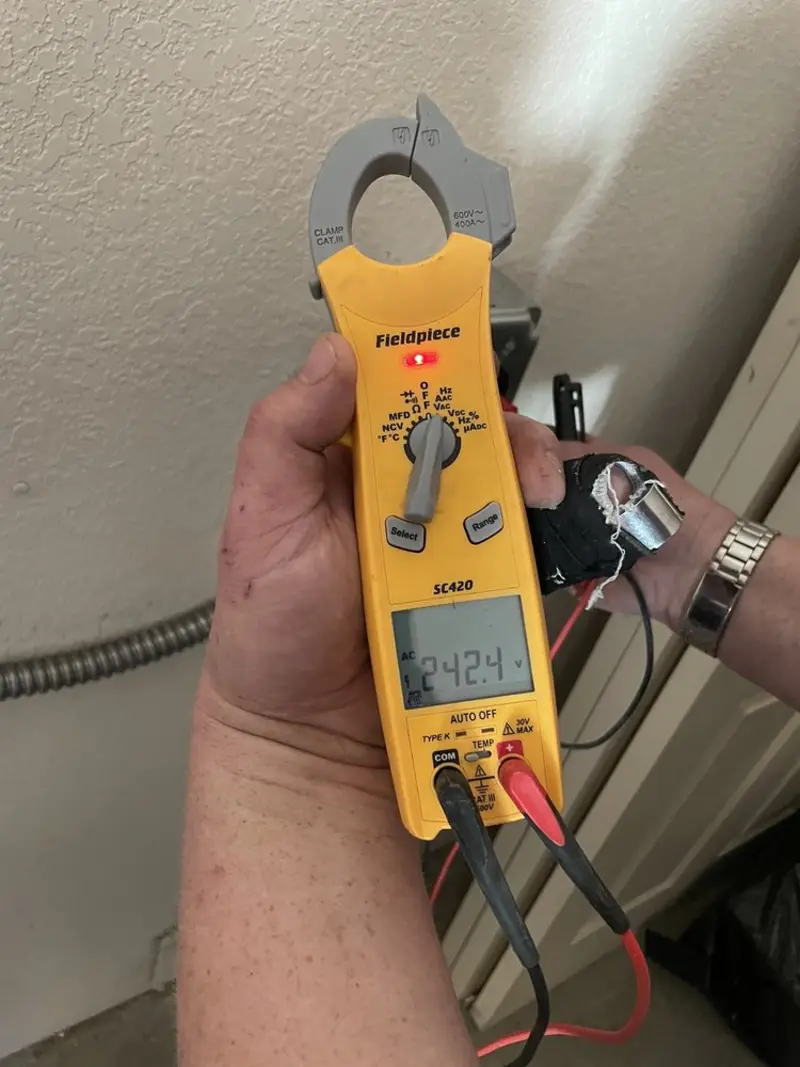 Voltage testing with clamp meter during Electrical Installation Services in Dartmouth